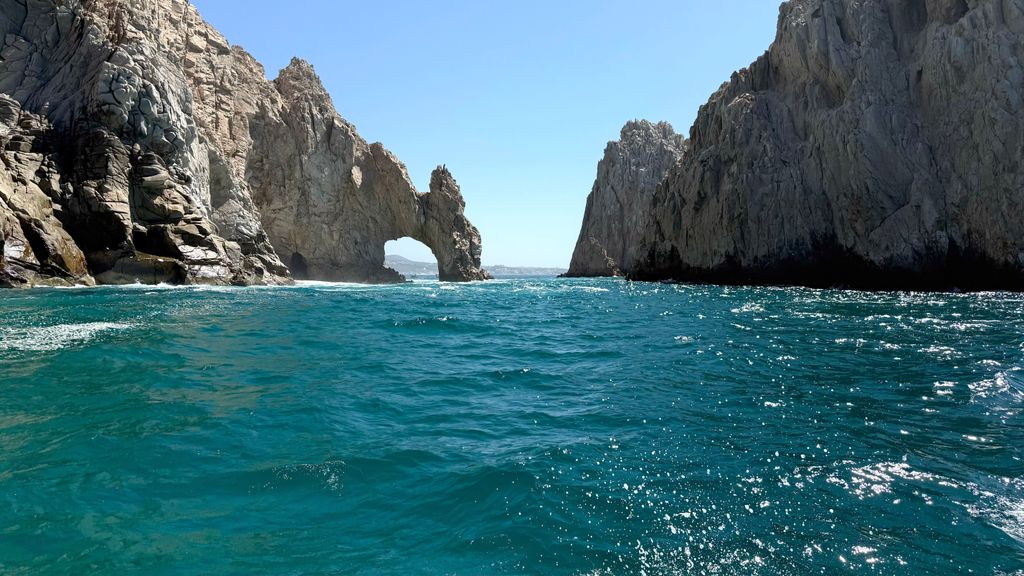 Stunning view of El Arco rock formation in Cabo San Lucas with vibrant blue sea.